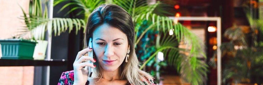 woman on phone in virtual therapy session