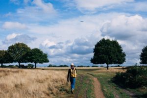 man walking in field